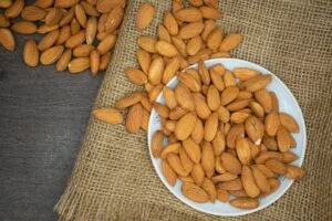 brown almond nuts on white plate