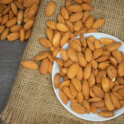 brown almond nuts on white plate