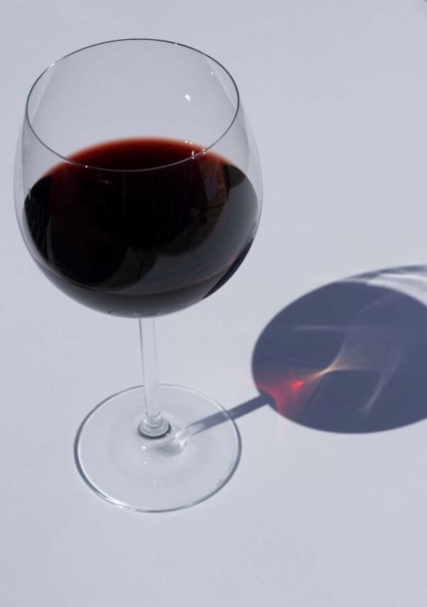 clear wine glass with red wine