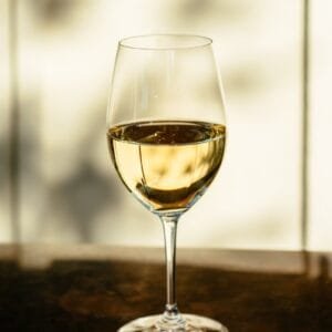 clear wine glass on brown wooden table