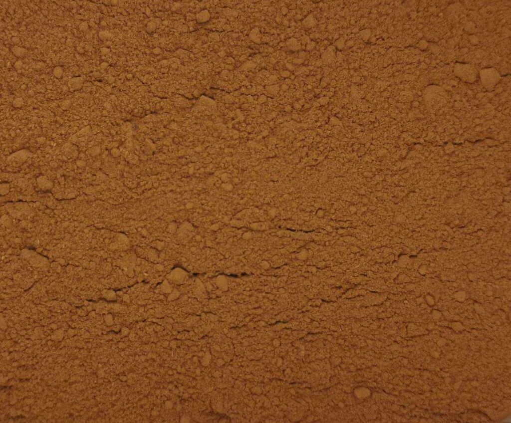 Close-up shot of risari powder, a natural reddish dye for eggs.