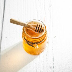 clear glass jar with brown liquid inside
