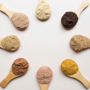 six different types of powdered spoons arranged in a circle